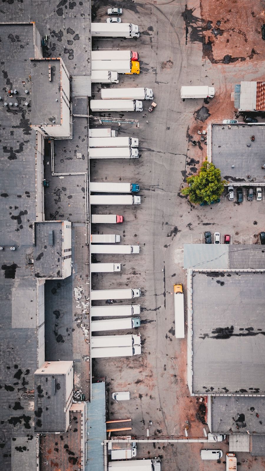 Aerial view of trucks docked at a distribution warehouse