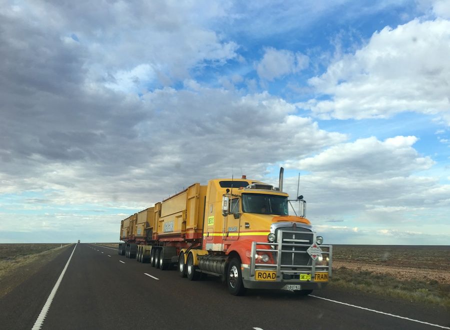 Large freight truck hauling a full trailer on the highway
