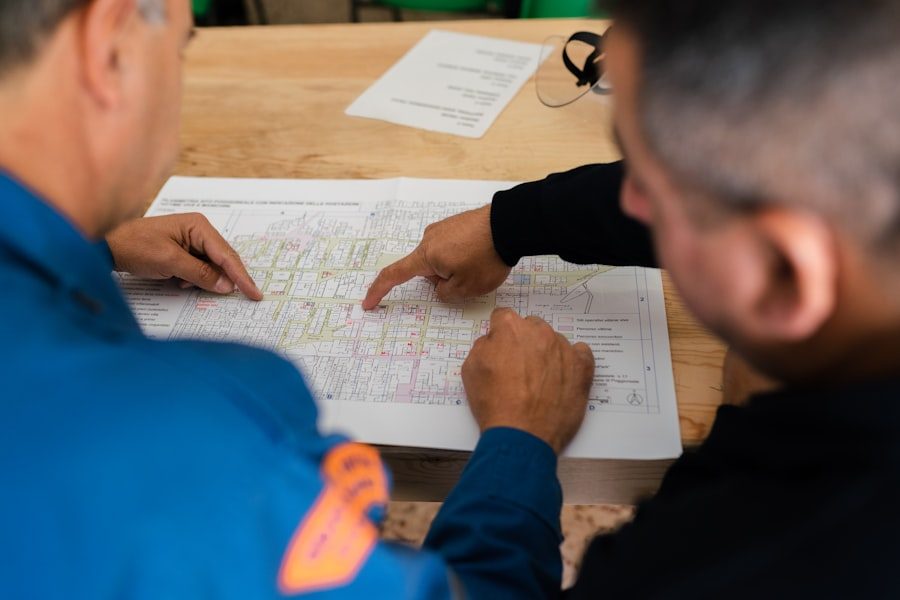 Two logistics staff reviewing a route map together